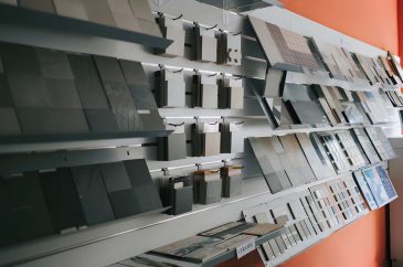 Tile samples on display at Jupiter Hardware showroom featuring ceramic textures, layout ideas, and color options.